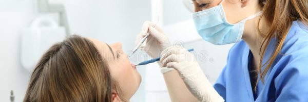 dentist-examining-patient-teeth-office-wearing-mask-gloves-blue-uniform-dental-probe-mirror-box-93793871