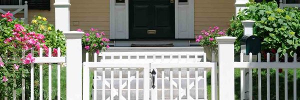 home-with-white-picket-fence-and-gate