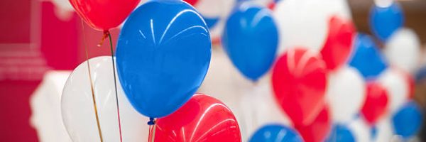 bunch of white, red and blue balloons