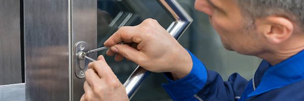 Mature Male Lockpicker Fixing Door Handle At Home